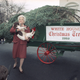 Illustration for article titled 70 Years of First Ladies Standing in Front of Christmas Trees